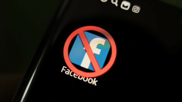 A crossed-out icon on a black smartphone screen. the concept of banning the application facebook. April 1, 2022. Barnaul. Russia